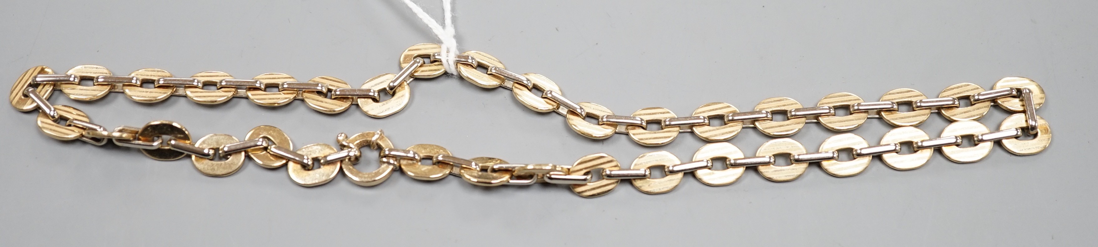 A two colour 9ct gold oval link necklace, 40cm